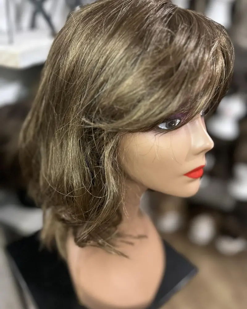 Brunette shag wig on a mannequin head